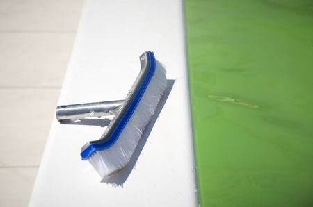 Brushing the surface of a pool to open it facing the summer seasonの写真素材