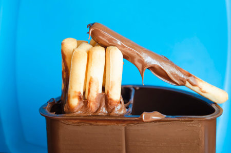 fresh baked appetizing biscuit sticks with chocolate