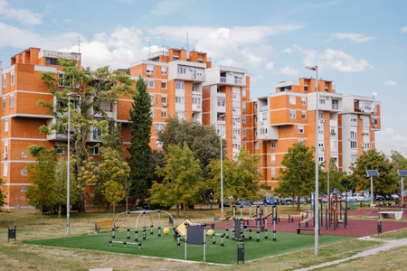 Children playground in the yard of a modern multi-storey building