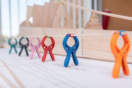 tongs holding wood rafts while dryingの写真素材