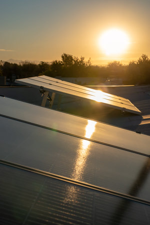 Solar energy panels against sunset skyの写真素材