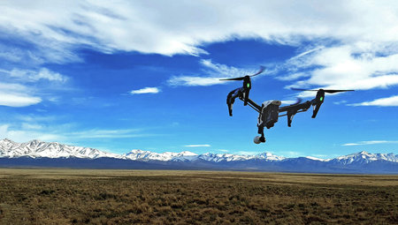 drone shooting with snowy mountains background