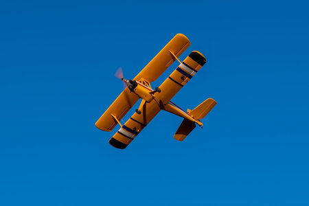 yellow biplane flying radio control
