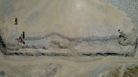 Machines working in cement quarry. top view.