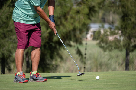 golfer shooting a golf ballの写真素材