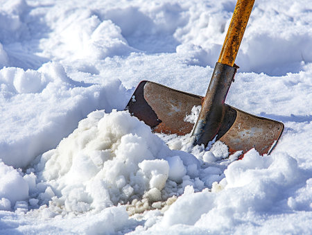 Close-up of shovel removing snow.の素材
