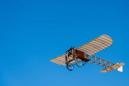 An old aircraft is flying in the sky. Radio Controlled Aircraft.の写真素材