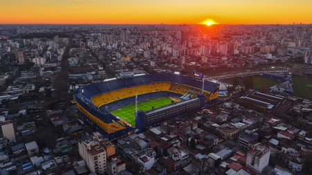 Buenos Aires, Argentina, August 10, 2025: Beautiful aerial view of Boca Juniors' "La Bombonera" football stadium at sunset. The city of Buenos Aires can be seen in the background.の写真素材