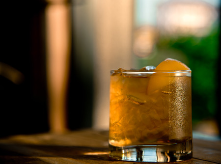 Iced tea with peach on wooden table for fresh in summerの写真素材