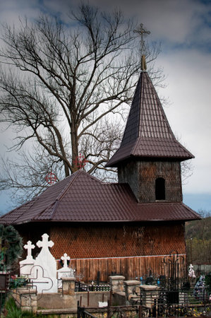 Brown wooden church cemetery on mountain village   Location  Luminis Romaniaの写真素材