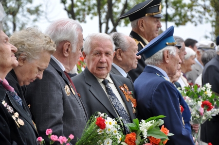 Unidentified veterans lay flowers at Victory Monument during the celebration of Victory Day on May...