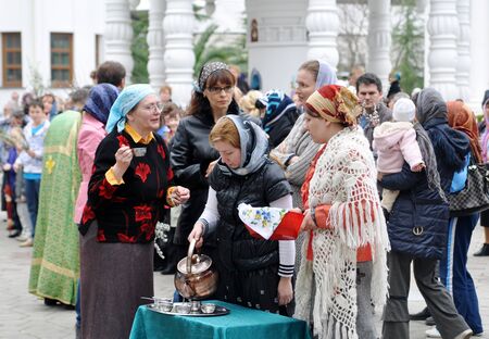 SOCHI, RUSSIA ï¿½ APRIL 15  Parishioners of the Cathedral of Archangel Michael in Sochi celebrate Palm Sunday on May 15, 2012  Women drink the holy waterのeditorial素材