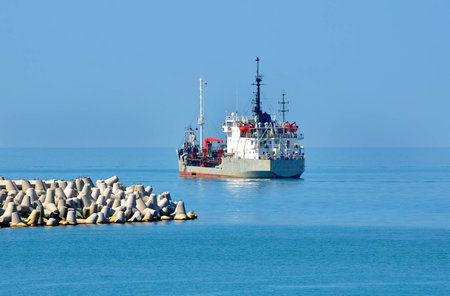 Suction Hopper Dredger near the buillt Seaport Mall