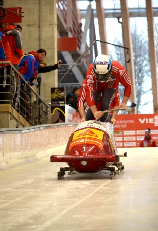 SOCHI, RUSSIA - FEBRUARY 16: FIBT Viessmann Bobsleigh @ Skeleton World Cup on February 16, 2013 in Sochi, Russia. Center Luge "Sanki". Team Austria on track.のeditorial素材