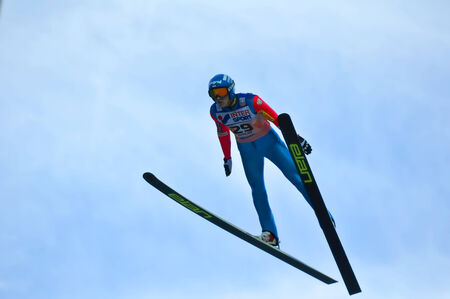 SOCHI, RUSSIA - DECEMBER 9, 2012  FIS Ski Jumping World Cup in Sochi on tramplin complex  RusSki Gorki   Unidentified athlete in flight のeditorial素材