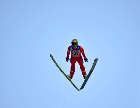 SOCHI, RUSSIA - DECEMBER 9, 2012: FIS Ski Jumping World Cup in Sochi on tramplin complex "RusSki Gorki". Unidentified athlete in flight.のeditorial素材