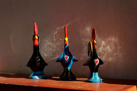 3 Traditional Portuguese rooster ornaments for sale in Obidos Portugalの写真素材