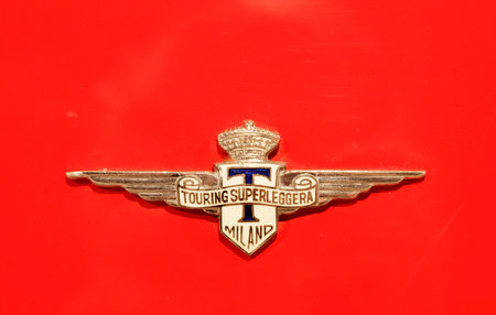 Modena / Italy - February 10 2018: Lamborghini Touring Superleggera Milano badge on a red panel in...