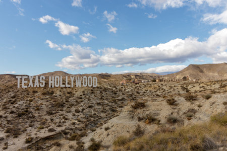 Almeria / Spain - January 26 2018: Texas Hollywood sign in Almeria Spain seen from a far with Fort Bravo behind itのeditorial素材