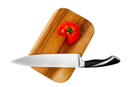 Cutting board with tomatoes and a knife isolated on white