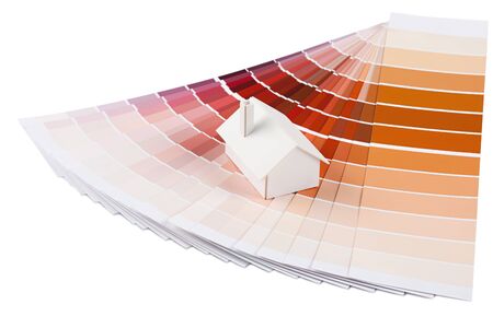 Small simple white model house on a color palette with different colors of red spectrum の写真素材