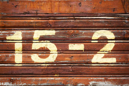 House number, sprayed on painted wooden wallの写真素材