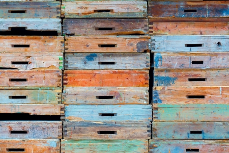 Stack of old wooden drawers painted in different colorsの写真素材