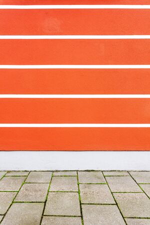 Empty lined red street wallの写真素材