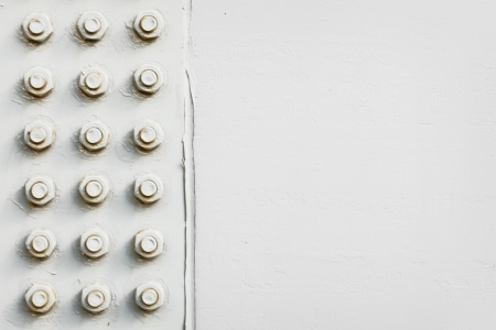 Detail of a steel structure with bolts painted in greyの写真素材