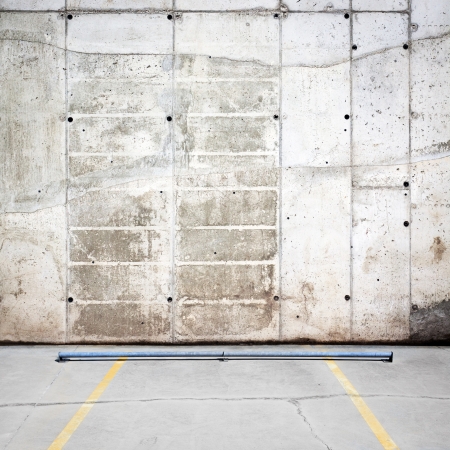 Urban grungy parking wall, may be used as background or textureの写真素材