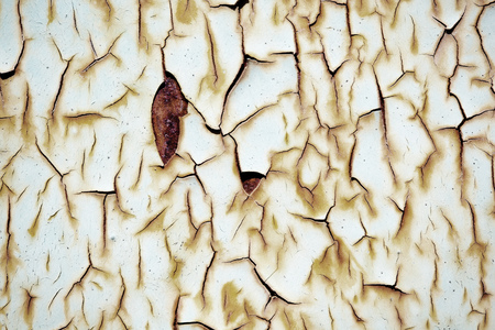 Close-up detail of cracked paint on wall.の写真素材