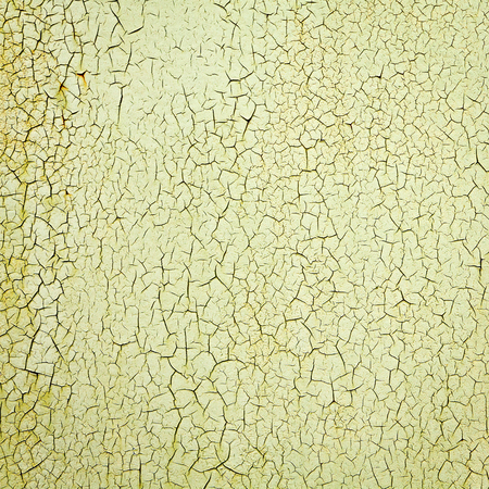 Close-up detail of cracked paint on wall.の写真素材