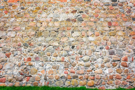 Old stone wall of a medieval castle.の写真素材