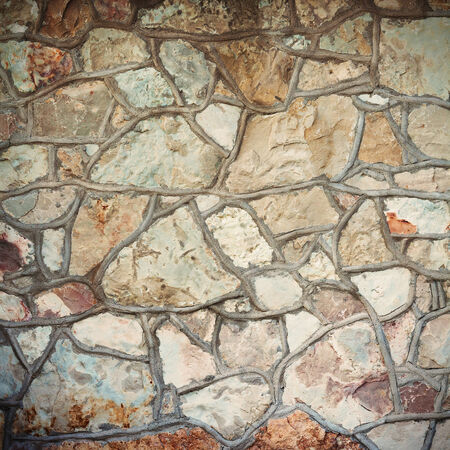 Old stone wall of a medieval castle.の写真素材