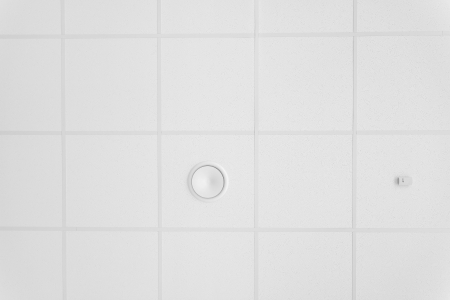 Ceiling detail with a air conditioning hole, standard in every officeの写真素材