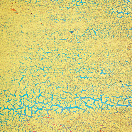 Close-up detail of cracked paint on wall.の写真素材