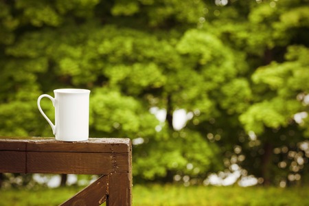 Cup of coffee on a rainy day in natureの写真素材