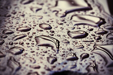 Wet wooden floor during rain, abstract background, shallow depth of fieldの写真素材