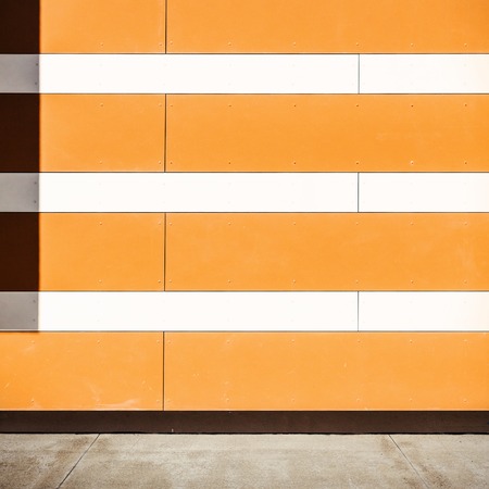 Empty lined orange street wallの写真素材