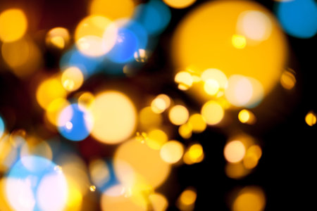 Blurred defocused bokeh lights on black background