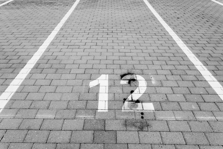Empty parking spot with a numberの写真素材