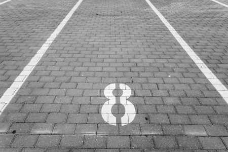 Empty parking spot with a numberの写真素材