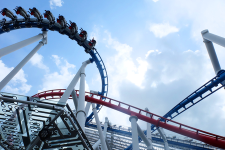 Rollercoaster against blue skyの写真素材