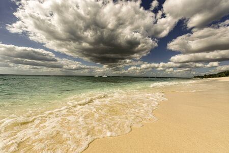 Beautiful sunny day on the shore with cloudsの写真素材