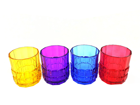 four multi-colored glasses isolated on a white backgroundの写真素材