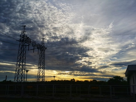 High voltage tower and power cable with sky backgroundの写真素材