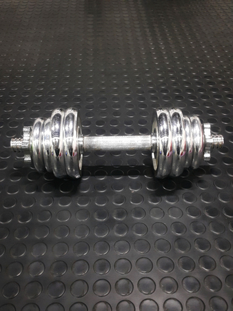 Top veiw chrome metal frame coated dumbells isolated on blackの写真素材