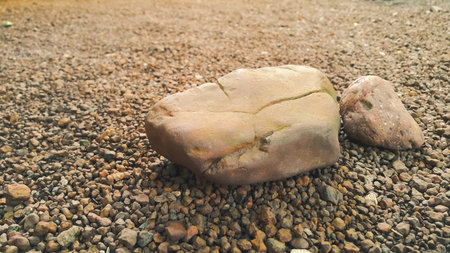 brown stone  on small stone floor