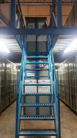 Interior of warehouse. Rows of shelves with parts and boxesの写真素材