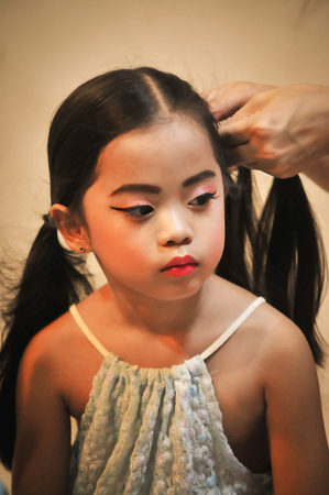 Little girls character creation set. Icons with different types of faces and hair style. she happy sitting in home, hair braiding ,doing make-upの写真素材
